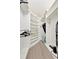 Bright walk-in closet with white custom shelving and rod system maximizes space and organization at 5624 Palmer Cir # 101, Bradenton, FL 34211