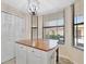 Dining area features a window with blinds, a chandelier, and a built in island at 5624 Palmer Cir # 101, Bradenton, FL 34211