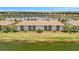Aerial view showing a building with a lake on the foreground at 5624 Palmer Cir # 101, Bradenton, FL 34211