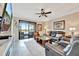 Comfortable living room offering great seating, and a view of the lake at 5624 Palmer Cir # 101, Bradenton, FL 34211
