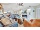 Relaxing living room featuring comfortable seating, a ceiling fan, and a fireplace at 5624 Palmer Cir # 101, Bradenton, FL 34211