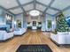 Elegant lounge area featuring a high ceiling, a bar, and stylish seating arrangements at 5624 Palmer Cir # 101, Bradenton, FL 34211