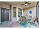 Inviting outdoor patio features a seating area, ceiling fan, and tasteful decor for relaxing at 5624 Palmer Cir # 101, Bradenton, FL 34211