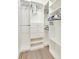 A walk-in closet has custom shelving and lots of space for storage and organization at 5624 Palmer Cir # 101, Bradenton, FL 34211