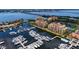 Beautiful aerial view of waterfront buildings by a marina with yachts at 606 Riviera Dunes Way # 306, Palmetto, FL 34221