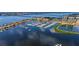 Waterfront complex with yachts along a marina and lush landscapes at 606 Riviera Dunes Way # 306, Palmetto, FL 34221