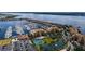 Scenic aerial view of condo complex by the water featuring a marina and well-maintained grounds at 606 Riviera Dunes Way # 306, Palmetto, FL 34221