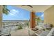 Spacious balcony showcasing water views, complemented by comfortable outdoor seating arrangements at 606 Riviera Dunes Way # 306, Palmetto, FL 34221