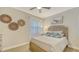 Charming bedroom features coastal decor and comfortable furnishings for a relaxing ambiance at 606 Riviera Dunes Way # 306, Palmetto, FL 34221