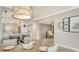 Open dining area view of the living room and kitchen at 606 Riviera Dunes Way # 306, Palmetto, FL 34221