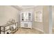 Bright dining area with modern hutch for storage at 606 Riviera Dunes Way # 306, Palmetto, FL 34221