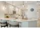 Bright and spacious kitchen with stainless steel appliances and marble countertops at 606 Riviera Dunes Way # 306, Palmetto, FL 34221