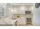 Well-equipped kitchen featuring modern appliances and ample counter space at 606 Riviera Dunes Way # 306, Palmetto, FL 34221