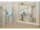 Contemporary kitchen with white cabinets, marble countertops, and modern appliances at 606 Riviera Dunes Way # 306, Palmetto, FL 34221