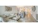 Open living room featuring comfortable seating, dining area, and access to the kitchen at 606 Riviera Dunes Way # 306, Palmetto, FL 34221