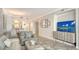 Spacious living room showcases modern decor, open layout, and views into the dining area at 606 Riviera Dunes Way # 306, Palmetto, FL 34221