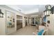 Well-lit lobby area features tile floors, seating, and elevators at 606 Riviera Dunes Way # 306, Palmetto, FL 34221