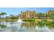 Picturesque view of a pond with a fountain, surrounded by manicured landscaping near the condos at 606 Riviera Dunes Way # 306, Palmetto, FL 34221