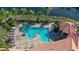 Resort-style community pool with lounge chairs, hot tub, and well-maintained tile decking at 606 Riviera Dunes Way # 306, Palmetto, FL 34221