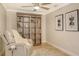 Cozy sitting room with comfortable seating, shelving, and neutral decor at 606 Riviera Dunes Way # 306, Palmetto, FL 34221