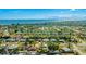 Aerial view showcasing the home's location with beautiful water views nearby and lush landscaping throughout the neighborhood at 6423 Georgia Ave, Bradenton, FL 34207