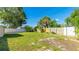 Expansive backyard with a storage shed, well-maintained lawn, offering plenty of space for outdoor activities at 6423 Georgia Ave, Bradenton, FL 34207