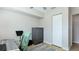 Study room has sleek desk, chair and neutral paint, with tile floor and closet at 6423 Georgia Ave, Bradenton, FL 34207