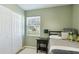 Relaxing bedroom with a bed, white closet, and a side table creating a calm and inviting space at 6423 Georgia Ave, Bradenton, FL 34207