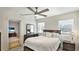 Comfortable bedroom with a ceiling fan and view into additional space at 6423 Georgia Ave, Bradenton, FL 34207
