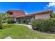 Well-maintained backyard with lush grass and mature landscaping at 6462 Draw Ln # 72, Sarasota, FL 34238