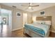 Cozy bedroom with a ceiling fan, comfortable bed, and easy access to the bath at 6462 Draw Ln # 72, Sarasota, FL 34238