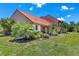 Home featuring well-maintained landscaping and a beautiful exterior at 6462 Draw Ln # 72, Sarasota, FL 34238