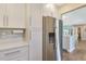 Bright kitchen with stainless steel refrigerator, ample storage, and sleek countertops at 6462 Draw Ln # 72, Sarasota, FL 34238