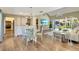 Open concept living room with modern decor, a vaulted ceiling, and natural light at 6462 Draw Ln # 72, Sarasota, FL 34238