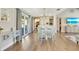 Well-lit living room featuring an open layout and access to the outdoors through sliding glass doors at 6462 Draw Ln # 72, Sarasota, FL 34238