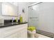 Bathroom with granite vanity and frameless glass shower at 6999 W Country Club N Dr # 224, Sarasota, FL 34243