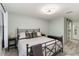 Bedroom with light green walls, wood-look tile, and a modern ceiling fan at 6999 W Country Club N Dr # 224, Sarasota, FL 34243
