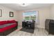 Bedroom with wood-look tile and view of the golf course at 6999 W Country Club N Dr # 224, Sarasota, FL 34243