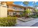 Charming condo exterior with lush landscaping, private balconies, and a clean, modern design at 6999 W Country Club N Dr # 224, Sarasota, FL 34243