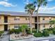 Charming condo building featuring well-kept landscaping, private balconies, and a welcoming entrance at 6999 W Country Club N Dr # 224, Sarasota, FL 34243