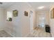 Bright hallway features tile floors, neutral walls, and stylish decor at 6999 W Country Club N Dr # 224, Sarasota, FL 34243