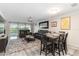 Bright living area with a dining space, comfortable sofas, and lovely golf course views at 6999 W Country Club N Dr # 224, Sarasota, FL 34243