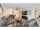 Bright living room with modern decor, spacious seating, and a seamless flow to the dining area at 6999 W Country Club N Dr # 224, Sarasota, FL 34243