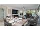 Open concept living room, seamlessly connected to a dining area, with stunning outdoor views at 6999 W Country Club N Dr # 224, Sarasota, FL 34243