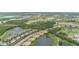Breathtaking aerial view of the golf course community surrounded by lakes and lush greenery at 7005 River Hammock Dr # 204, Bradenton, FL 34212