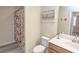 Bathroom showcasing a vanity, toilet, and shower with a colorful curtain at 7005 River Hammock Dr # 204, Bradenton, FL 34212