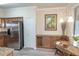 Cozy dining area with a stylish table and a modern stainless refrigerator at 7005 River Hammock Dr # 204, Bradenton, FL 34212