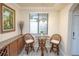 Charming breakfast nook featuring a glass table and modern decor at 7005 River Hammock Dr # 204, Bradenton, FL 34212