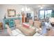 Coastal dining area with a glass table, wicker chairs, and stylish decor at 7005 River Hammock Dr # 204, Bradenton, FL 34212