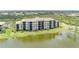 Beautiful condominium complex with lake views and lush landscaping at 7005 River Hammock Dr # 204, Bradenton, FL 34212